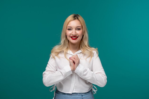 Free photo cute girl blonde beautiful young girl in a white neat shirt hoping for something very excited