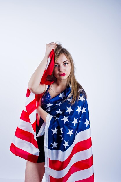 Cute girl in bra and shorts with american usa flag isolated on white background