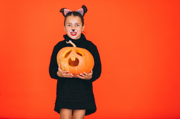 Free Photo cute girl dressed in halloween costume in studio