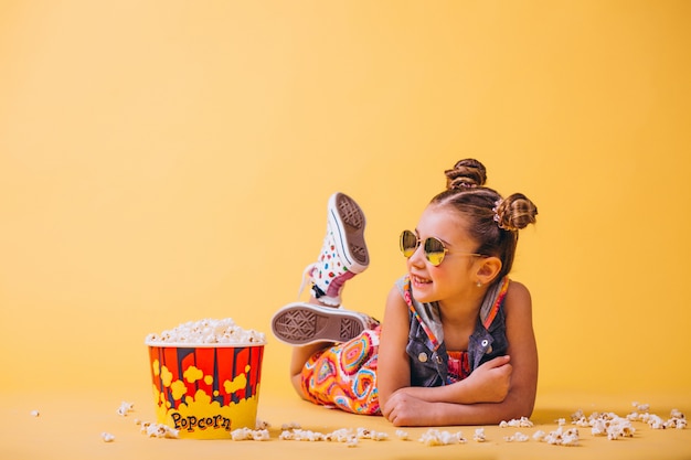 Free Photo cute girl eating popcorn