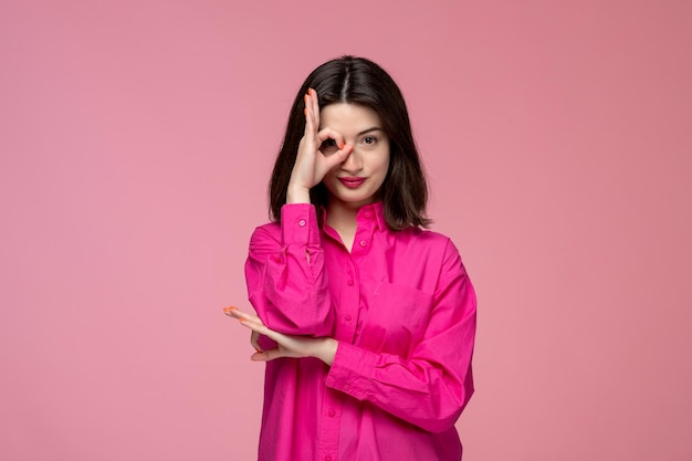 Free photo cute girl lovely adorable lady with red lipstick in pink shirt covering one eye with hand