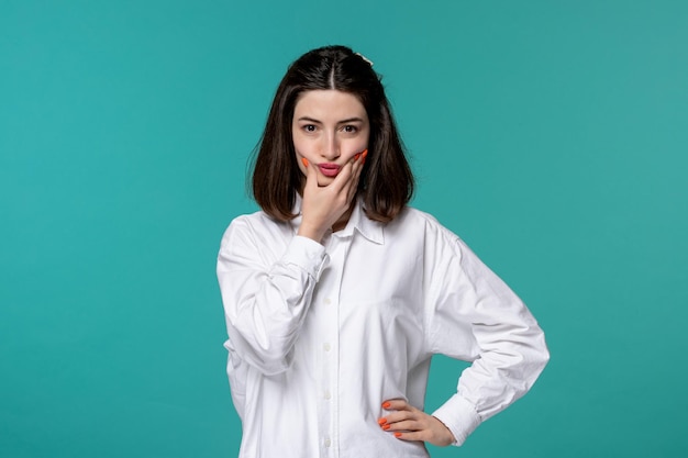 Cute girl lovely young pretty brunette girl in white shirt making funny face