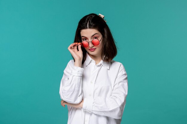 Cute girl pretty brunette young sweet girl in white shirt looking over glasses