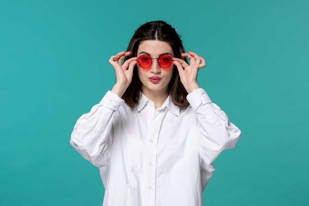 Cute girl pretty brunette young sweet girl in white shirt wearing red glasses