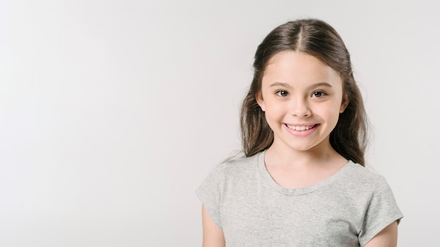 Cute girl smiling in studio