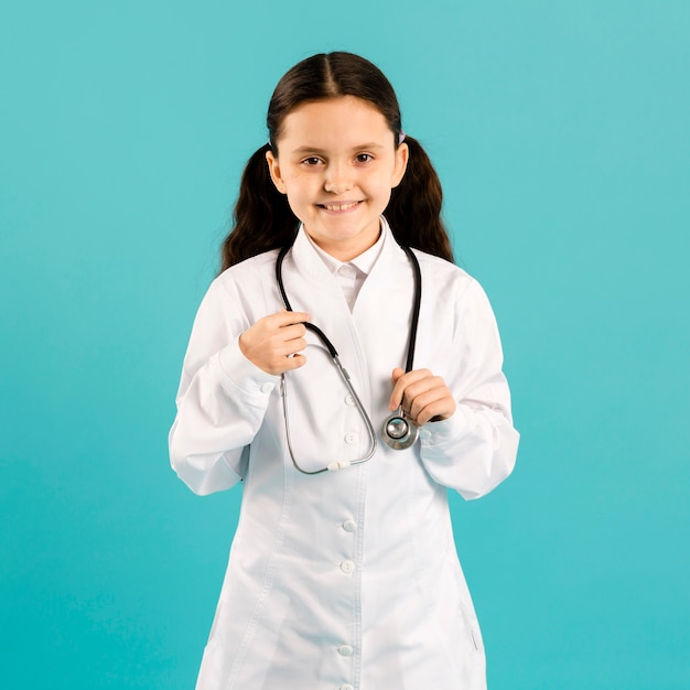 Cute girl wearing doctor uniform