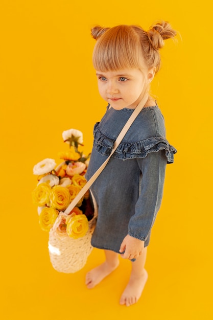 Free photo cute girl wearing flower basket