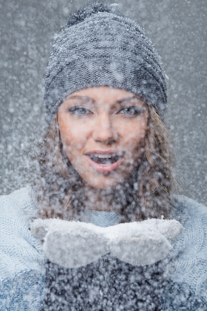 Free photo cute girl with snowflakes having a good time