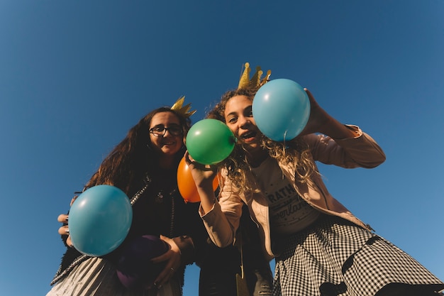 Free Photo cute girls having fun with balloons