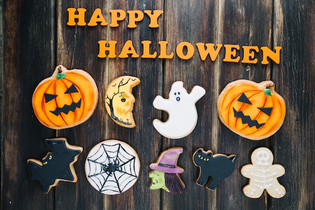 Free Photo cute halloween cookies and happy halloween superscription