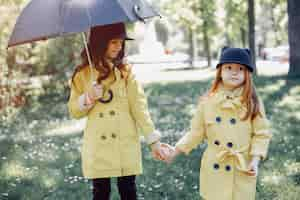 Free photo cute kids plaiyng on a rainy day