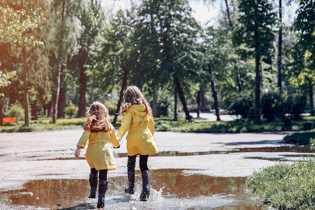 Free photo cute kids plaiyng on a rainy day