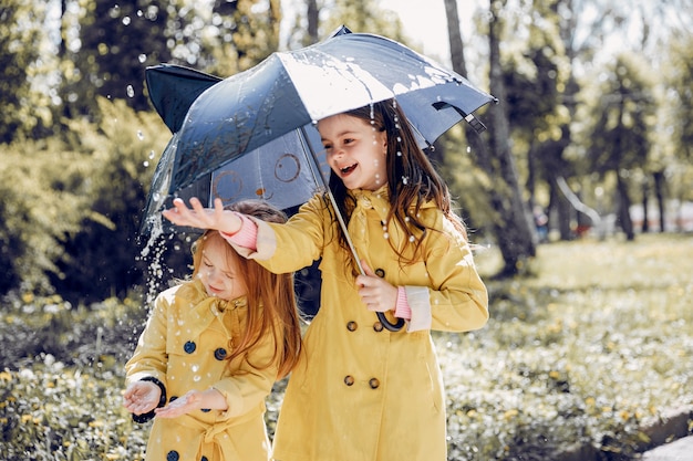 Cute kids plaiyng on a rainy day