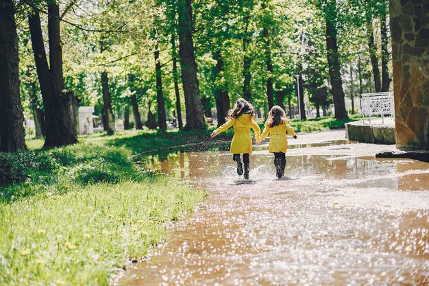 Cute kids plaiyng on a rainy day