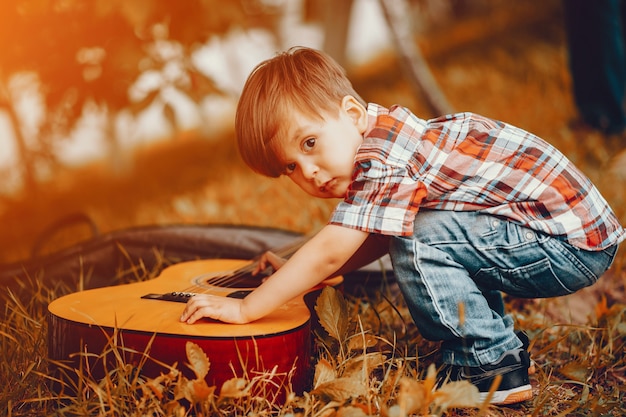 Free photo cute little boy playing in a park