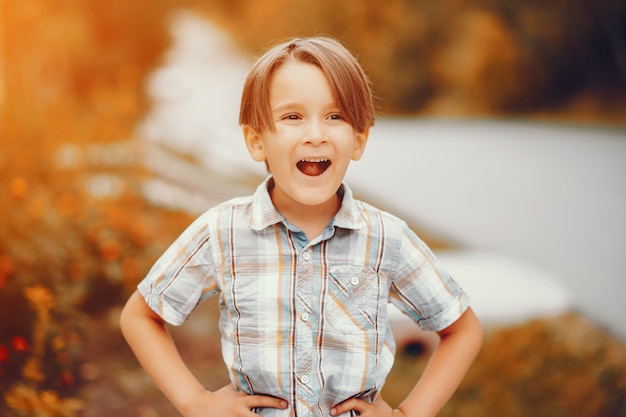 Free photo cute little boy playing in a park