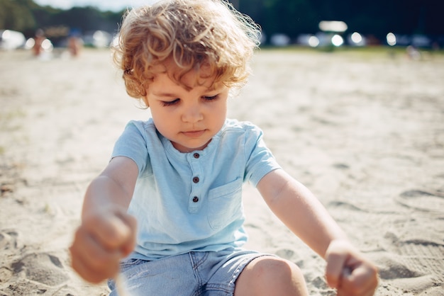 Free photo cute little children playing on a sand