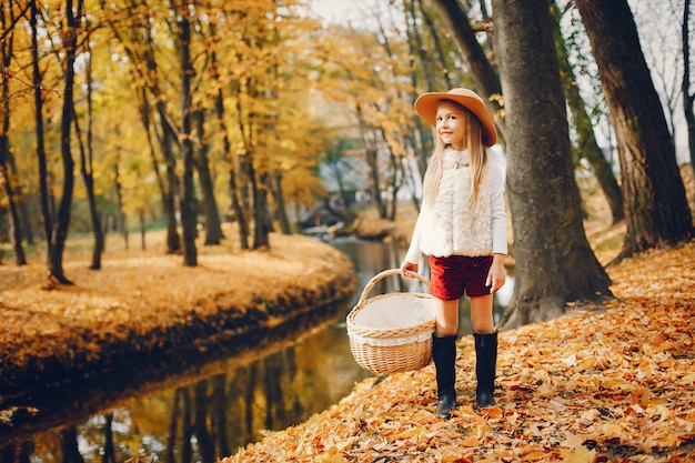 Cute little girl in a autumn park