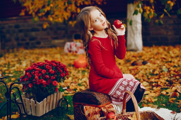 Cute little girl in a autumn park