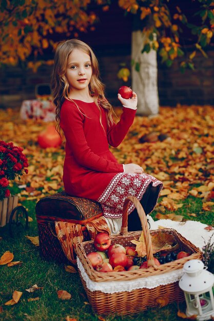 Cute little girl in a autumn park