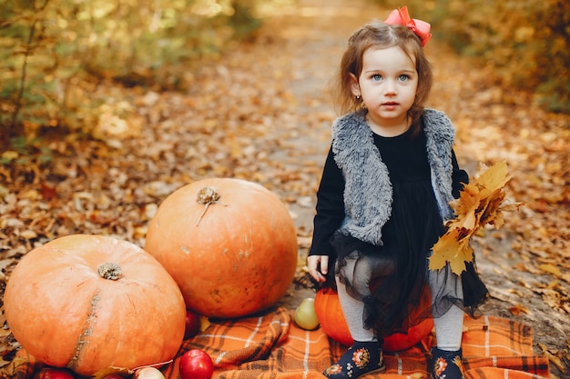 Cute little girl in a autumn park