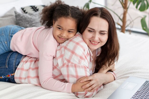 Cute little girl happy to be home with her mother