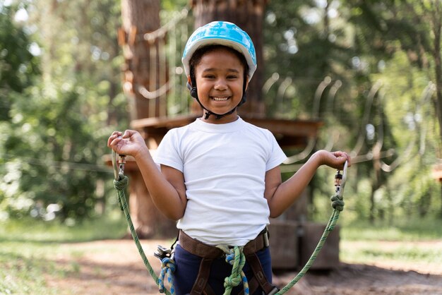 Cute little girl having fun at an adventure park