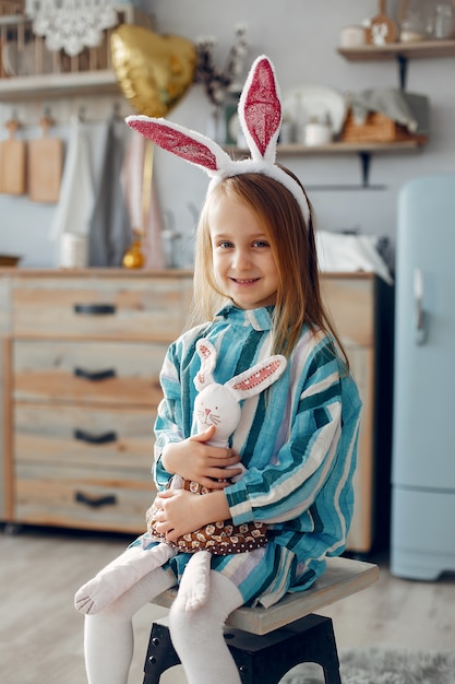 Cute little girl sitting at home 