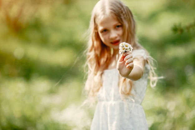 Free photo cute little girl in a spring park