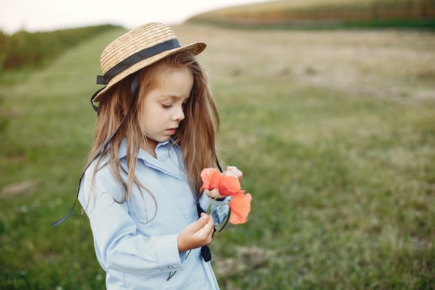 Cute little girl in a summer field