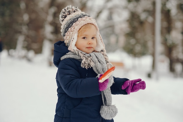 Cute little girl in winter park