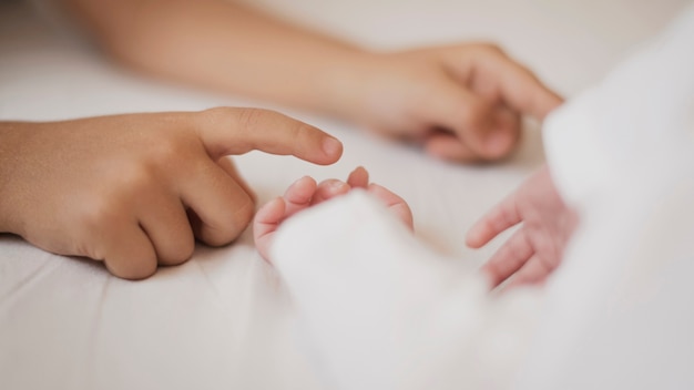 Cute little hands touching each other