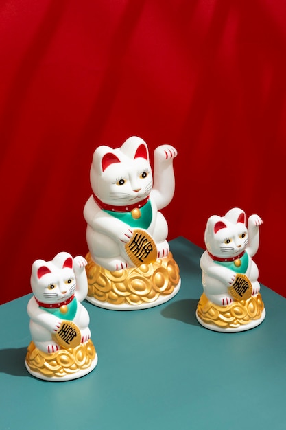 Free photo cute lucky cats arrangement high angle