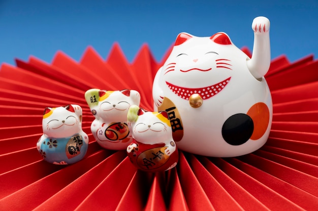 Cute lucky cats with red paper arrangement