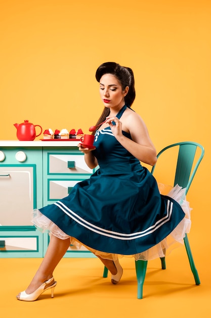 Cute pinup girl in the kitchen