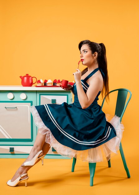 Cute pinup girl in the kitchen