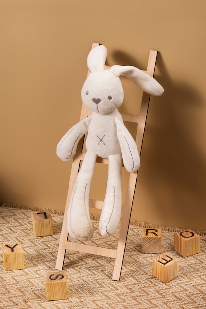 Free Photo cute plush toy and ladder arrangement