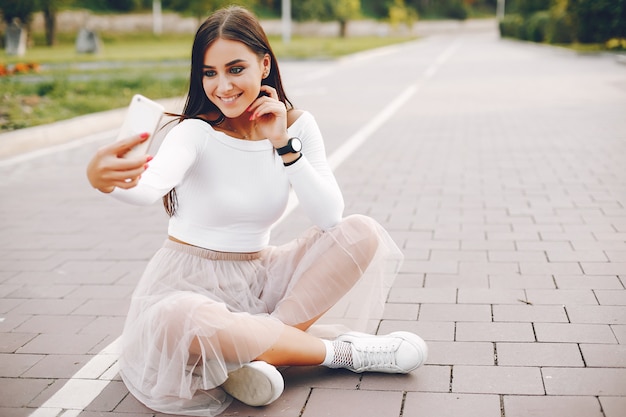 Free photo cute and pretty girl in a summer park