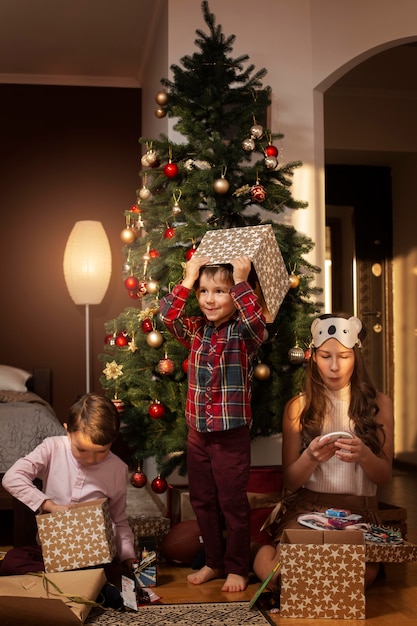 Cute siblings celebrating christmas together