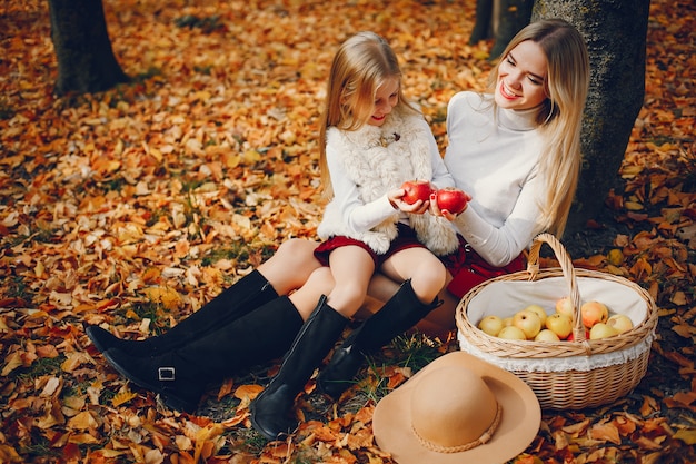 Cute and stylish family in a autumn park