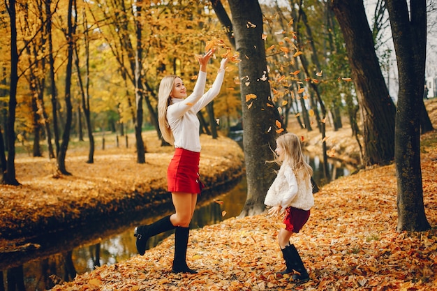 Cute and stylish family in a autumn park