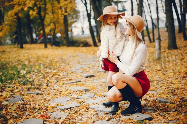 Cute and stylish family in a autumn park