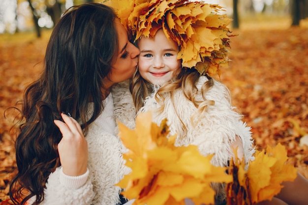 Cute and stylish family in a autumn park