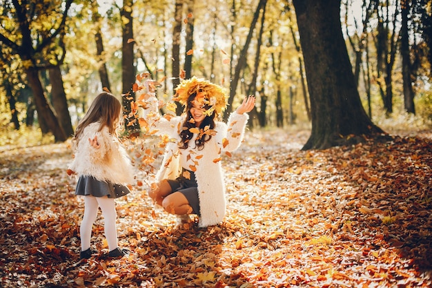 Free photo cute and stylish family in a autumn park