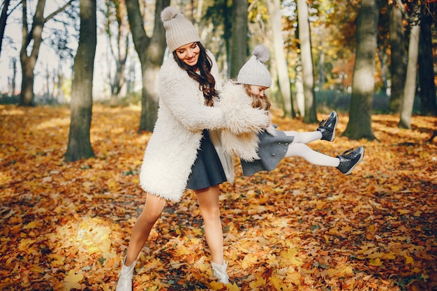 Free photo cute and stylish family in a autumn park