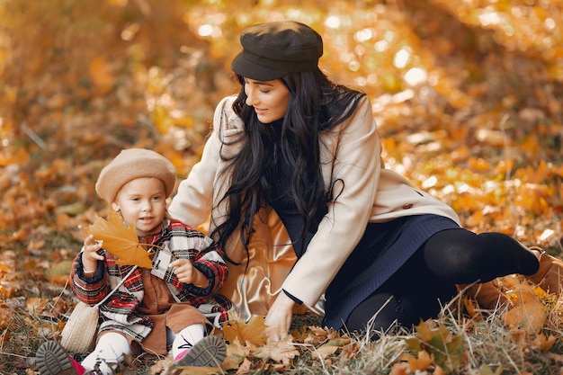 Cute and stylish family in a autumn park