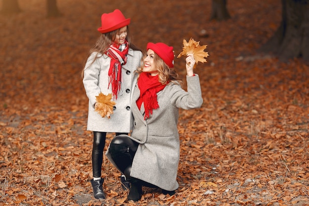 Cute and stylish family in a autumn park