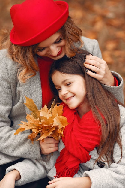 Cute and stylish family in a autumn park