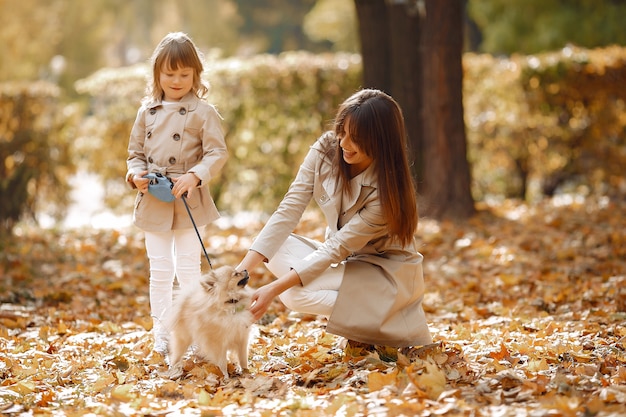 Cute and stylish family in a autumn park