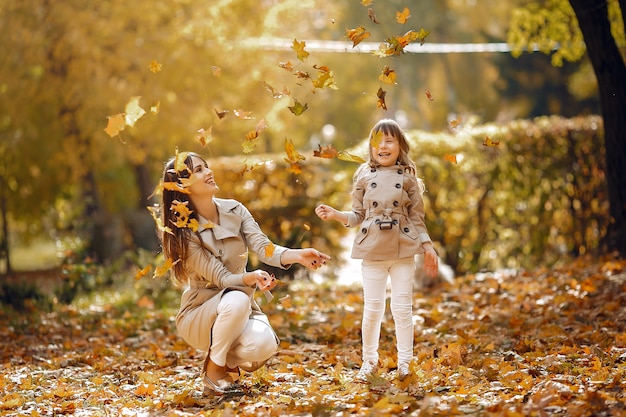 Cute and stylish family in a autumn park